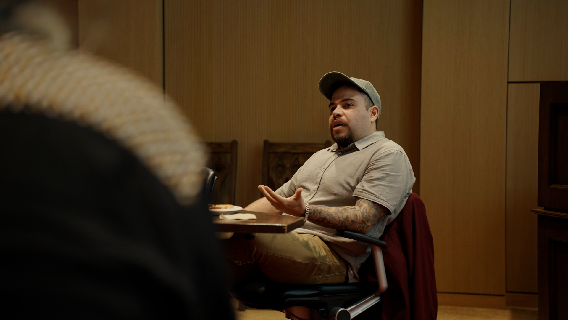 Michael Chavez Booth speaks to a classroom.